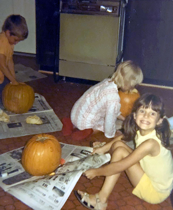 Heidi carving pumpkins at a young age, a healthy start to my wellness journey